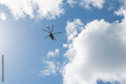 helicopter in flight against a cloudy sky