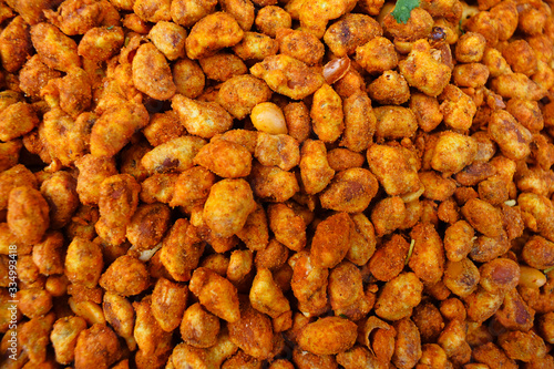 Spicy, salted, fried, hot, peanuts pattern or background top view photo