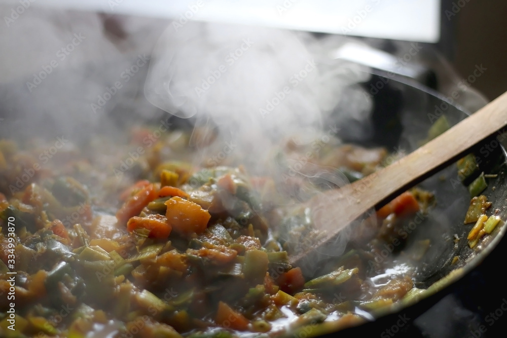 Stir- fry leek, carrot and squash with soy sauce, in a wok. Selective focus. Stir- fry leek, carrot and squash with soy sauce, in a wok. Selective focus.