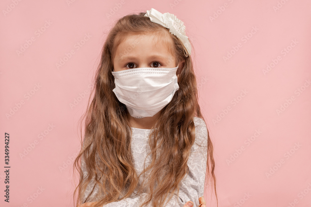 Coronavirus and air pollution concept. Little girl in a protective mask Coronavirus and air pollution concept. Little girl in a protective mask