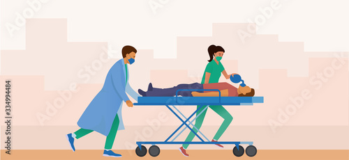 Medical team resuscitates  affected person. Doctors take the patient to a medical gurney. The man has difficulty breathing. Doctor uses a manual device for artificial ventilation of the lungs (avl).