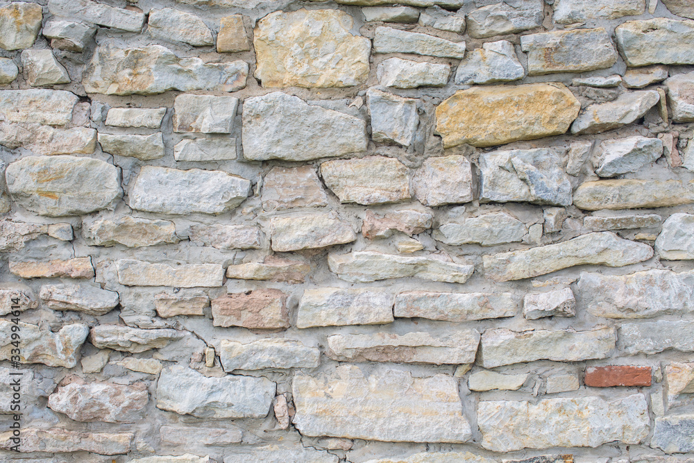 Fototapeta premium old masonry, old wall of rubble stone