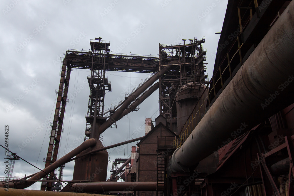 Daytime general view of the pipelines of the metallurgical industry. Leading to a blast furnace for pig iron smelting.