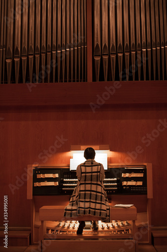 Organist playing a pipe organ