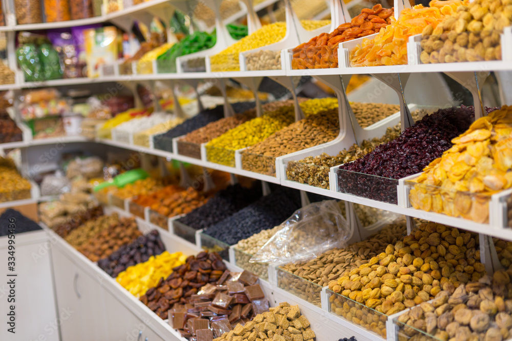 Market stall with various dried fruits and nuts