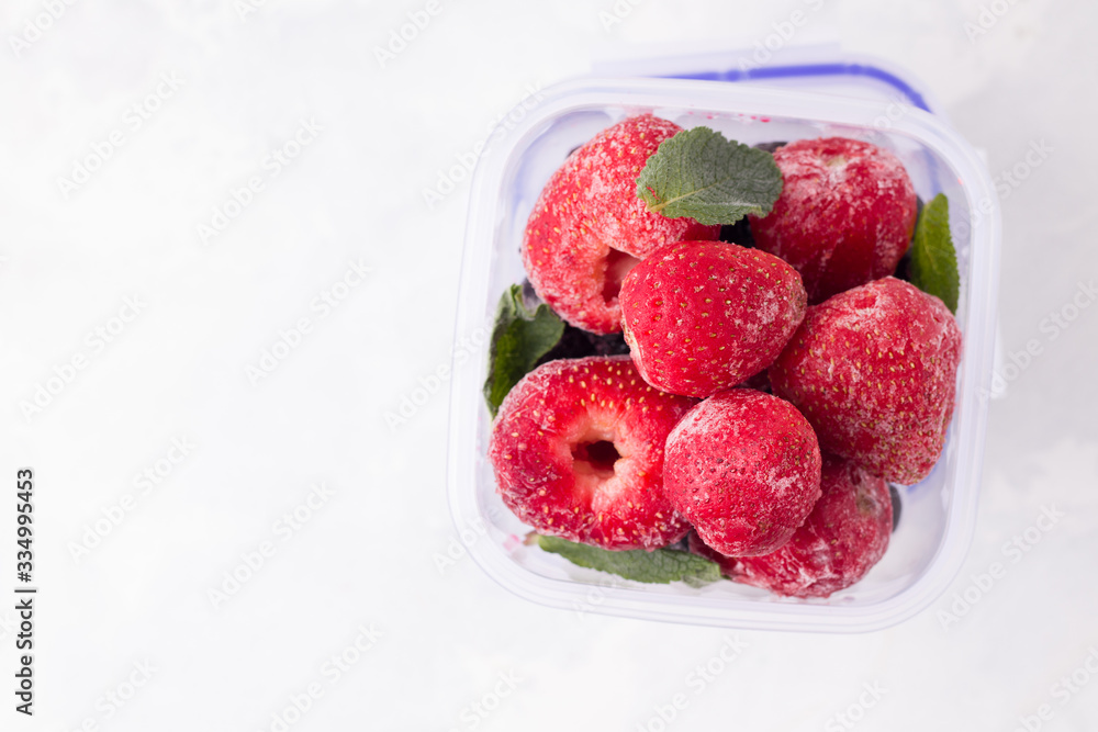 frozen strawberries on a white background top view. copy space frozen strawberries on a white background top view. copy space