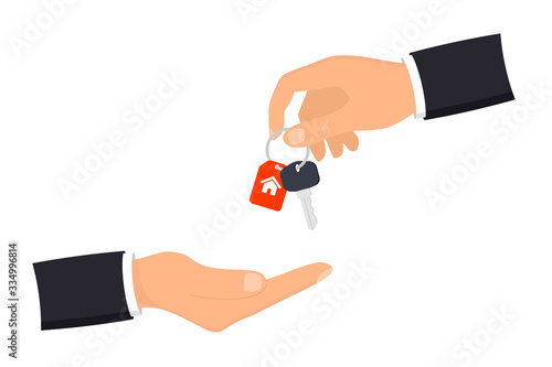 Hand giving house keys to customer. Businessman in suit giving house key. Mortgage, credit or property concept. Sale and rent of apartment. Buying a house. Sale and purchase concept
