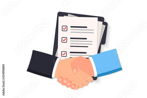 Сoncluding a contract with a handshake. Two hands doing a handshake, business concept. Conclusion of the contract, approval of documents. Business Shaking hands. Contract papers, documents