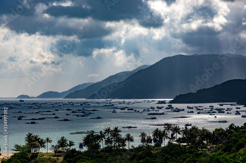 Fishing boats and freight ships in a bay in Vietnam