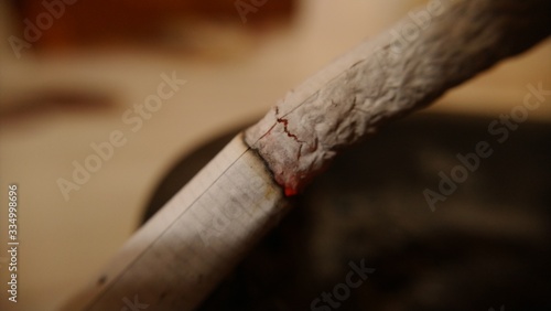 Cigar macro with ash handing