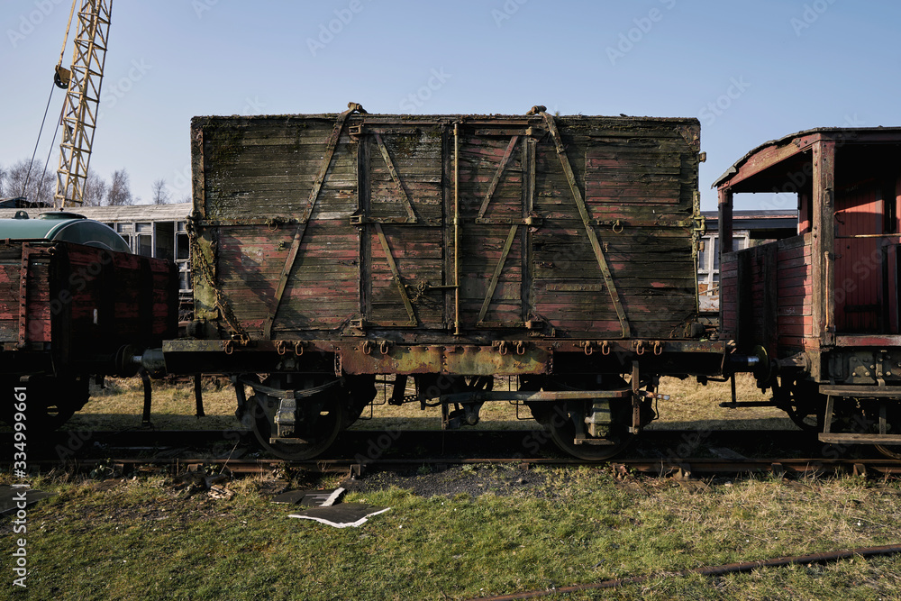 Abandoned train depot with various trains and carriages in different states of decay. Abandoned train depot with various trains and carriages in different states of decay.
