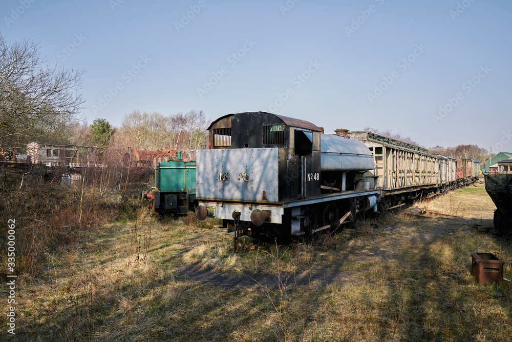 Abandoned train depot with various trains and carriages in different states of decay. Abandoned train depot with various trains and carriages in different states of decay.
