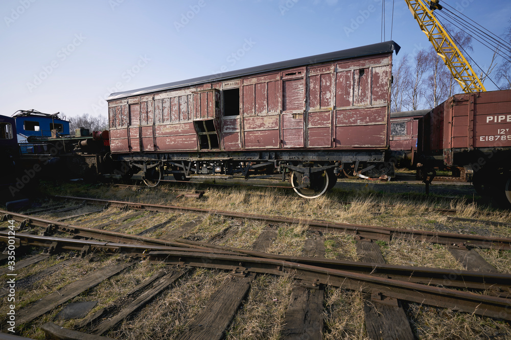 Abandoned train depot with various trains and carriages in different states of decay. Abandoned train depot with various trains and carriages in different states of decay.