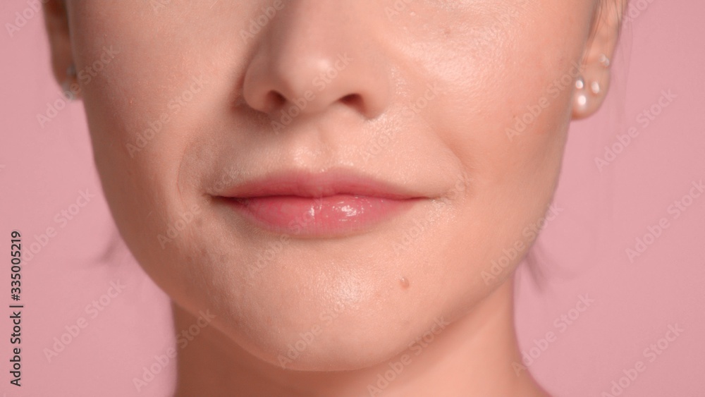 unrecognizable womans lips closeup after lip mask lip treatment. Self-care concept unrecognizable womans lips closeup after lip mask lip treatment. Self-care concept
