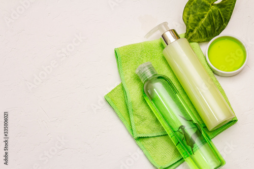 Personal care at home. Gel and tonic water with green tea  bath towel. Natural ingredient spa concept