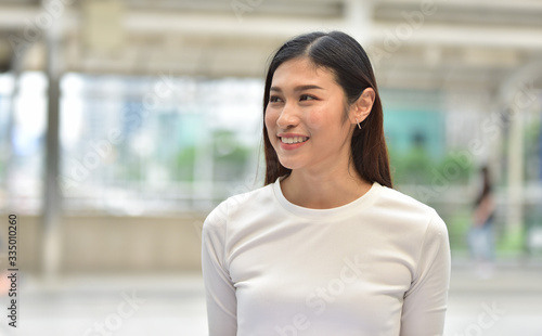 Portrait of a beautiful young woman in town have a good mood.	