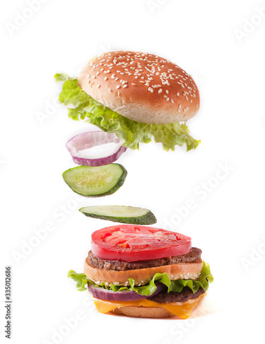 Burger in flight on a white background