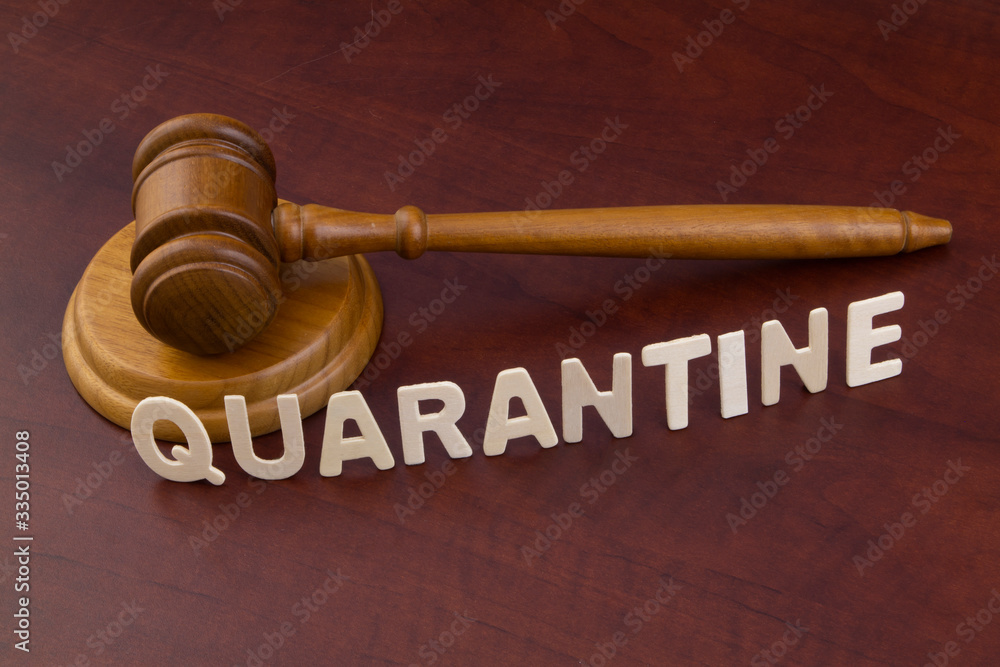Judge gavel with word quarantine. Laws and quarantine concept. Judge gavel with word quarantine. Laws and quarantine concept.