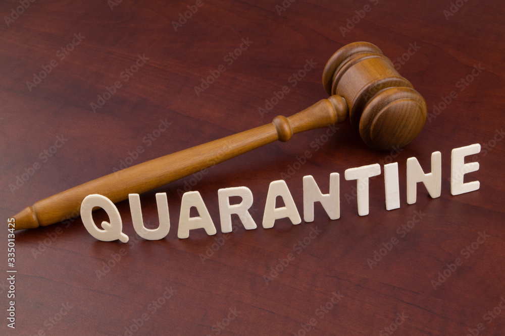 Judge gavel with word quarantine. Laws and quarantine concept Judge gavel with word quarantine. Laws and quarantine concept