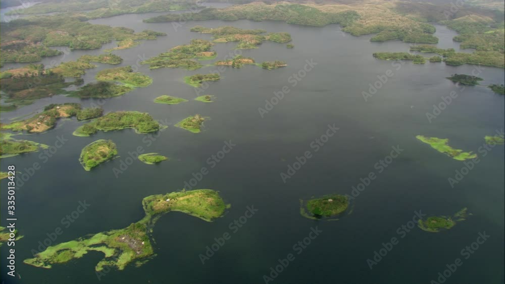 Aerial view of Lake Bayano, small islands with palms and cloud forest in Panama Central America, filmed with Cineflex stabilization 5-Axis camera system Aerial view of Lake Bayano, small islands with palms and cloud forest in Panama Central America, filmed with Cineflex stabilization 5-Axis camera system