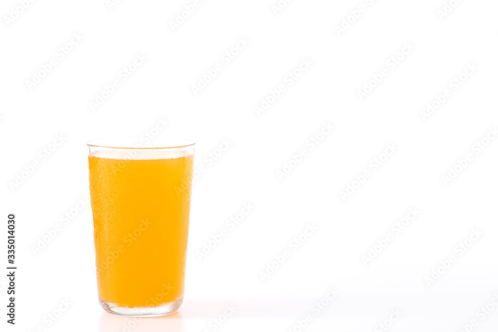 glass of orange juice on white glass of orange juice on white