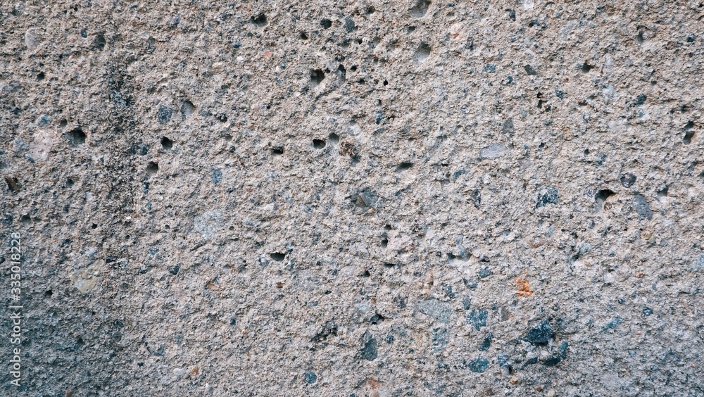Macro Close up of cement concrete wall texture abstract background with cracked small hole. style material for interior or exterior of building... Macro Close up of cement concrete wall texture abstract background with cracked small hole. style material for interior or exterior of building...