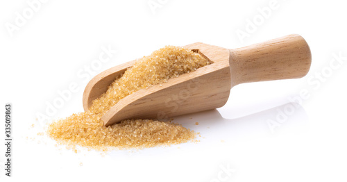 brown sugar in wood scoon on white background