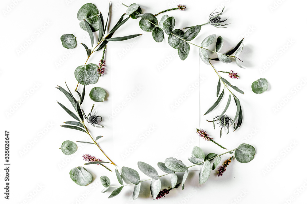 Fototapeta premium Modern spring design with plants on white background top view mock-up