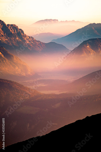 Fog in the valley during sunrise photo