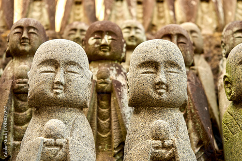 Many stone statues of budha in Japan