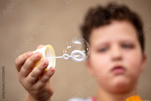 Soap bubble in the hand.