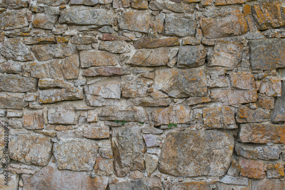 Masonry wall surface texture. Natural stone wall. Old stone blocks background