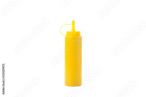 Yellow mustard bottle isolated on white background
