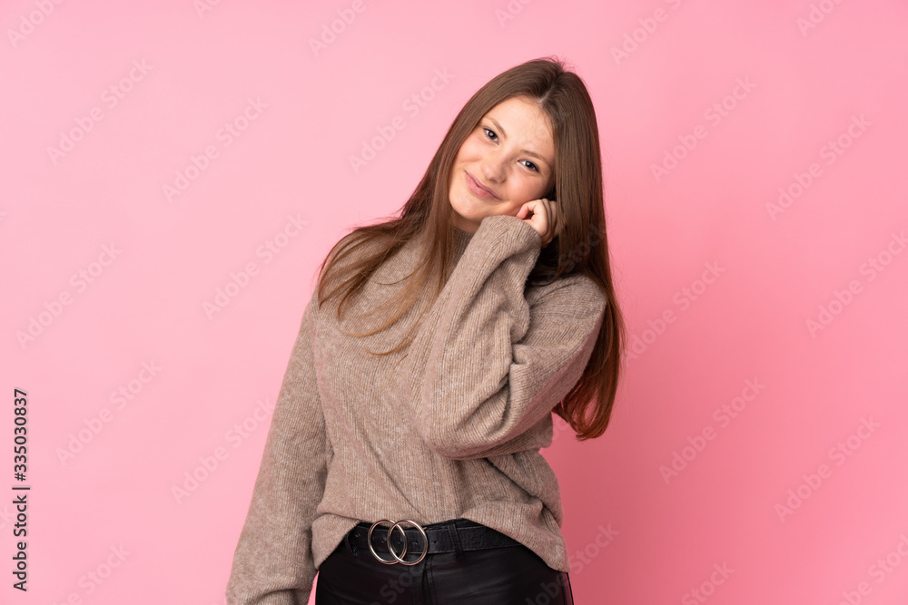 Teenager caucasian girl isolated on pink background laughing Teenager caucasian girl isolated on pink background laughing