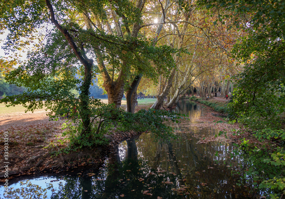The park beside the Alzon River in Uzès, France is a popular escape in the fall.