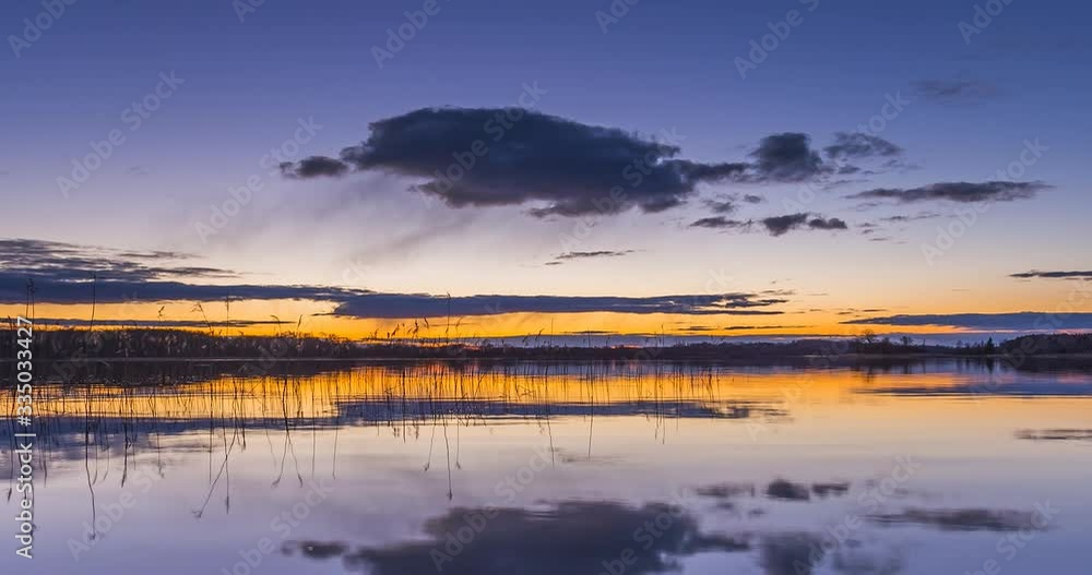 Calm lake water in the evening blue hour Calm lake water in the evening blue hour