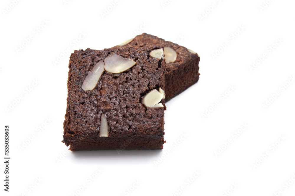 Chocolate brownie with sliced almond nuts toppings isolated on white background. Chocolate brownie with sliced almond nuts toppings isolated on white background.