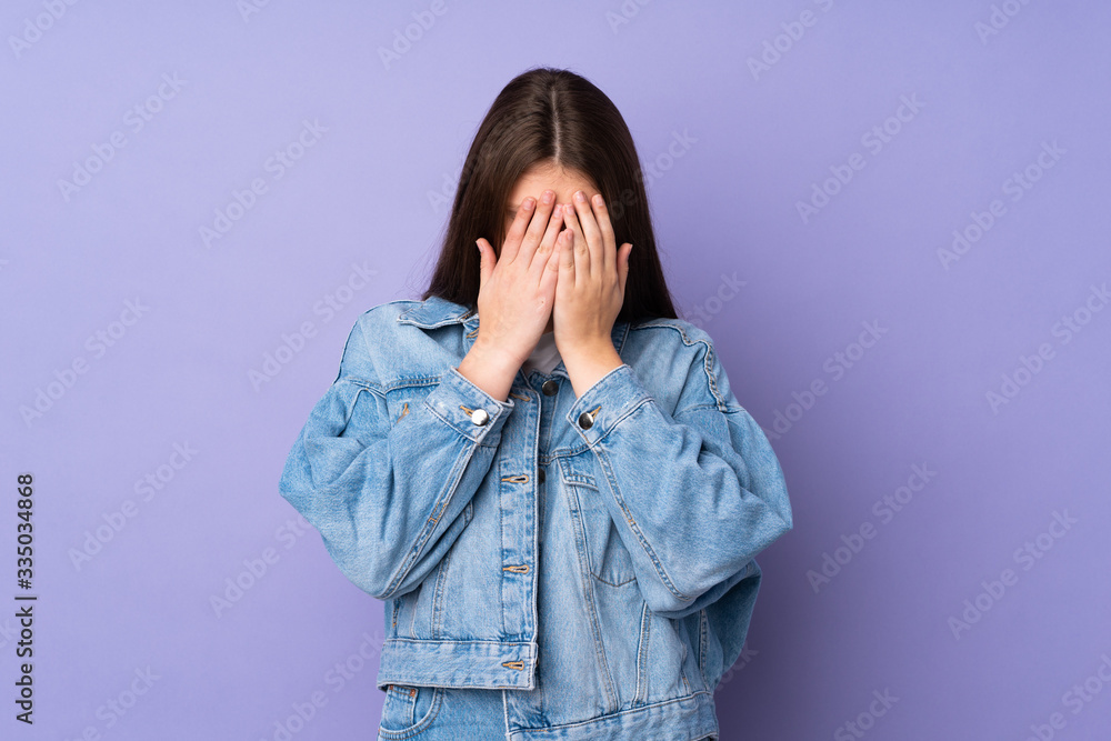 Teenager caucasian girl isolated on purple background with tired and sick expression Teenager caucasian girl isolated on purple background with tired and sick expression
