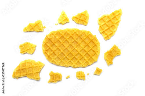 Waffle crisp wafer butter flavor biscuits and crumbs isolated on white background.