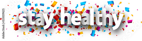 Small letters stay healthy sign over confetti.