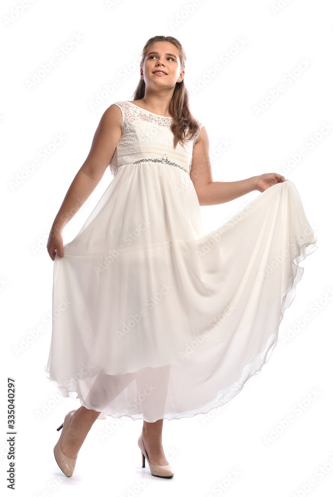 Beautiful blonde teen girl in white dress