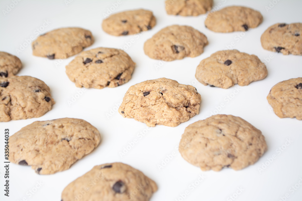 Homemade chocolate cookies in rows on a white background Homemade chocolate cookies in rows on a white background