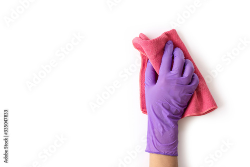 Obraz na płótnie Closeup hand with gloves holding pink duster microfiber cloth for cleaning isolated on white background with clipping path