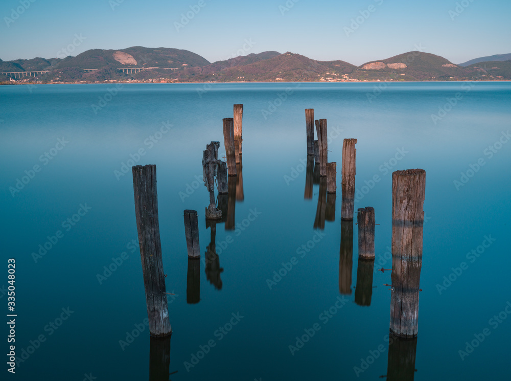Old pier at Puccini lake, Tuscany, Italy Old pier at Puccini lake, Tuscany, Italy