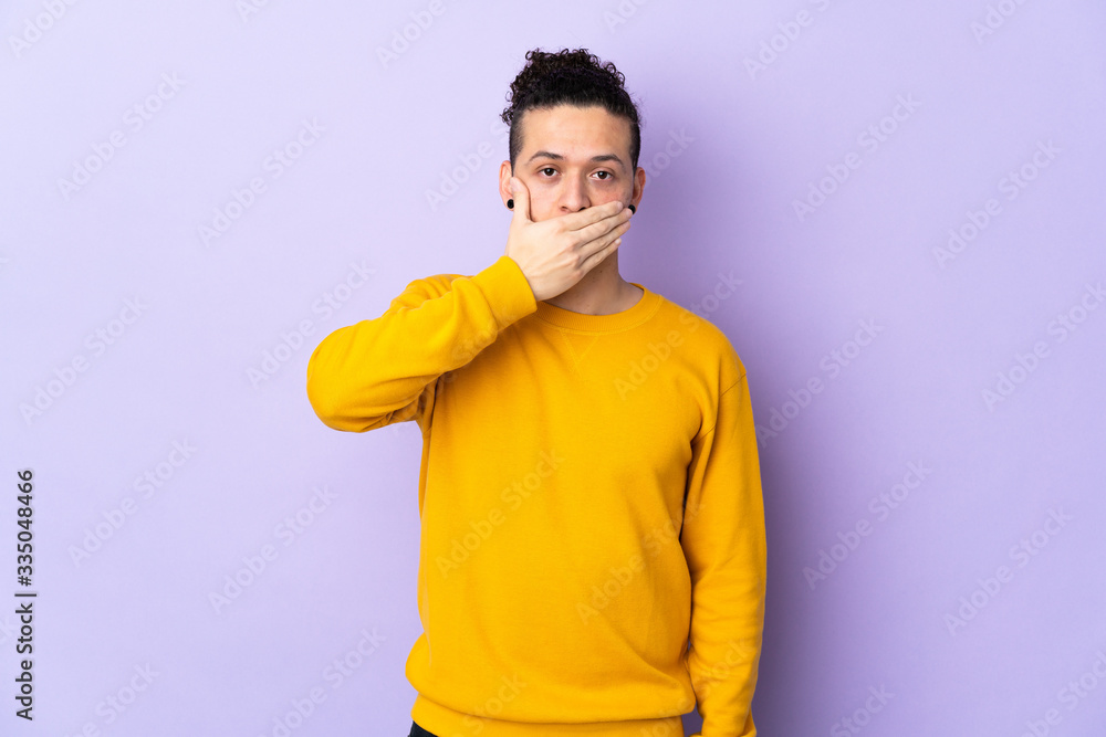 Caucasian man over isolated background covering mouth with hand Caucasian man over isolated background covering mouth with hand