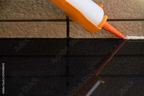 Fotografie Caulking gun isolated.