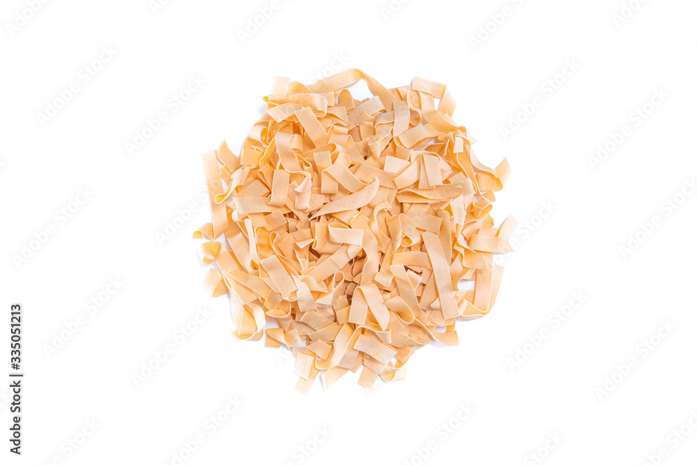 Uncooked heap dried pasta tagliatelle