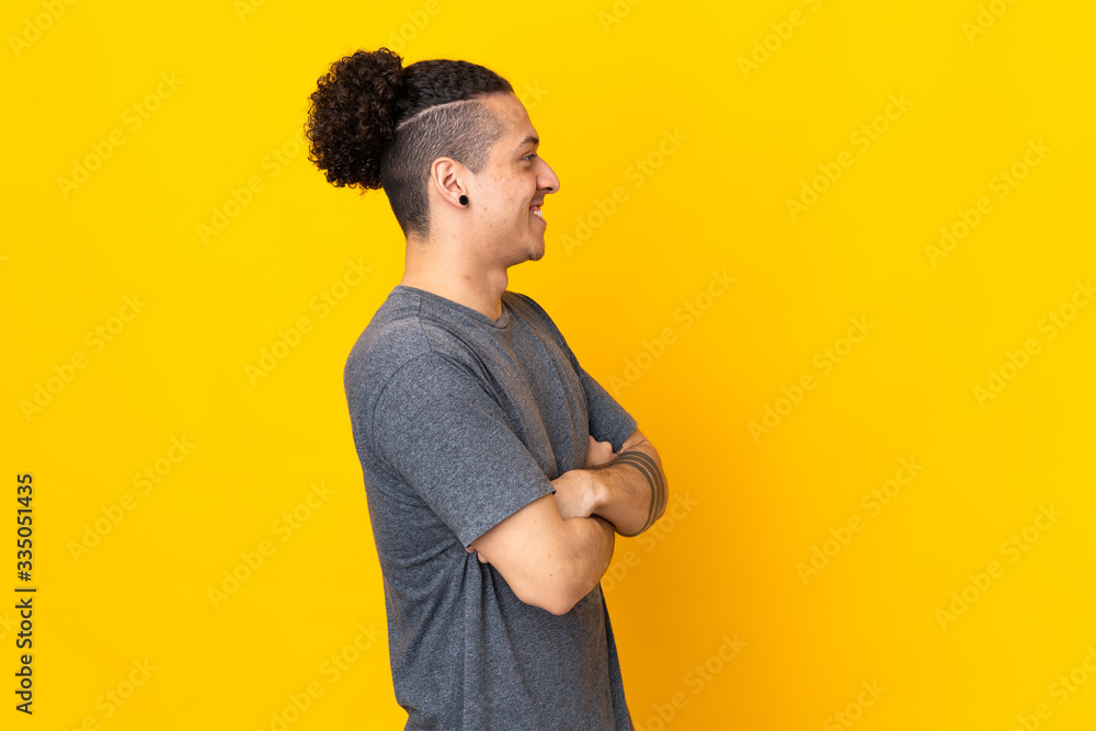 Caucasian man over isolated background in lateral position Caucasian man over isolated background in lateral position