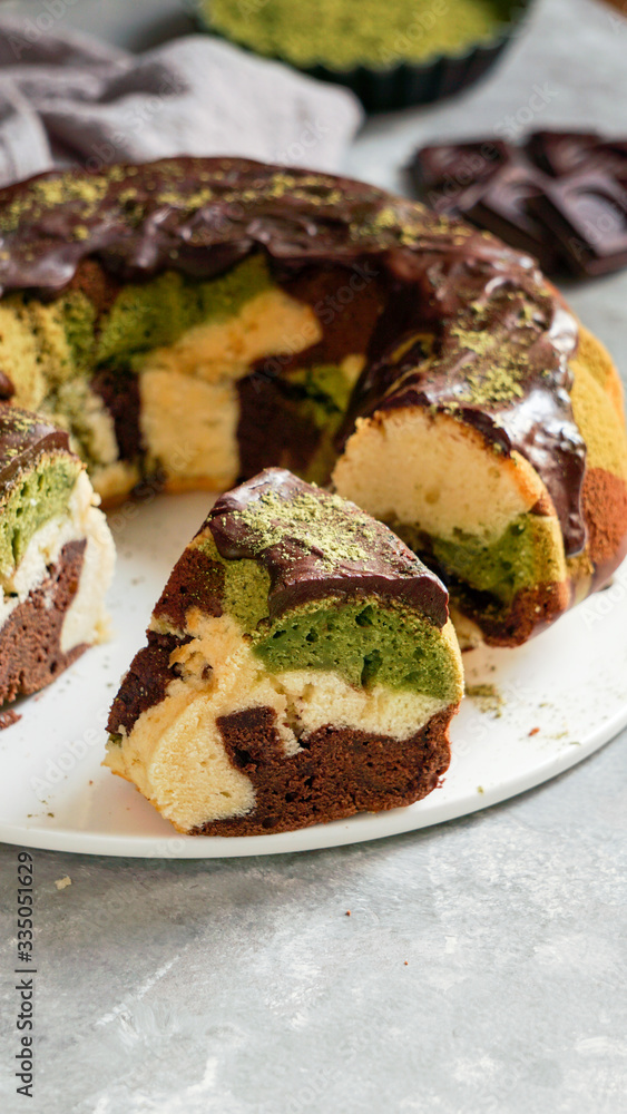 matcha green tea and chocolate cake. top  view, copy space, grey background