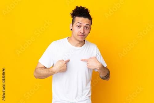 Caucasian man over isolated background pointing to oneself